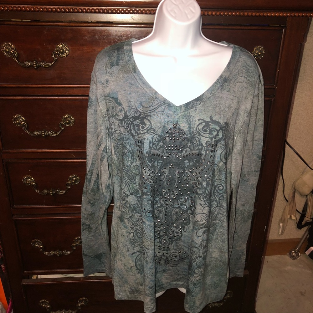 2 Green source long sleeve shirts.